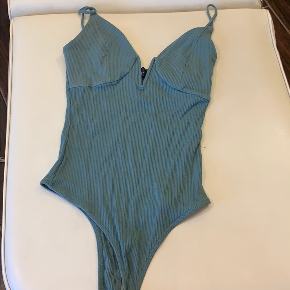 Luke’s ribbed body suit